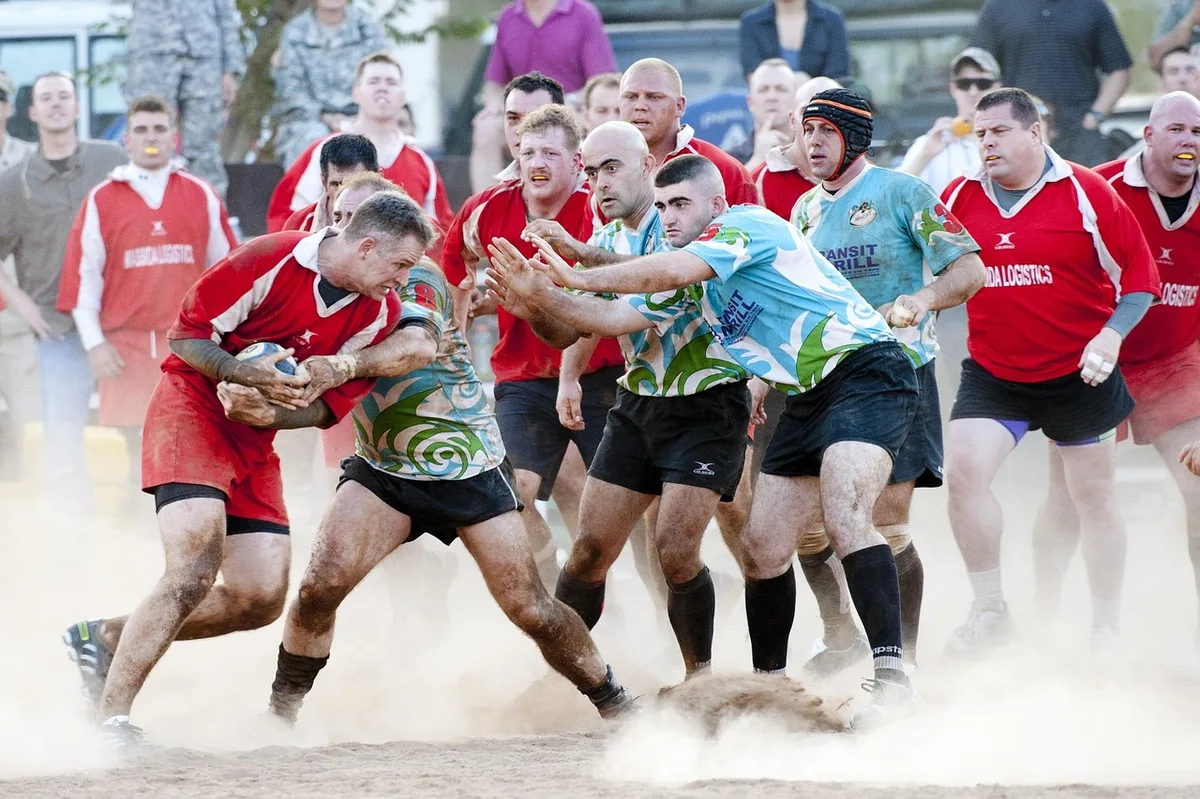 Joueurs de rugby partageant un moment de camaraderie et d'amitié